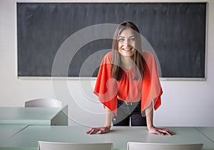 Female teacher in front of a classroom