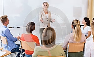 Female teacher lecturing to students
