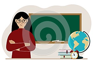 Female teacher near the blackboard. The concept of education, teaching, teacher's day.