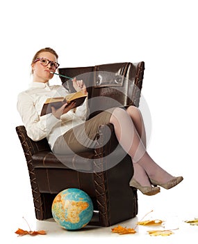 Female teacher sitting in armchair