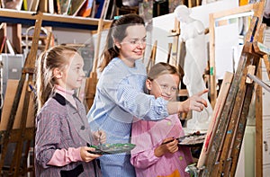 Female teachers assisting students