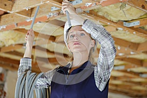 Female technician holding cables