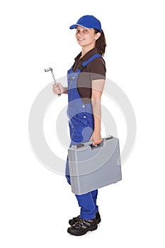 Female technician holding toolkit