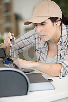 female technician repairing computer