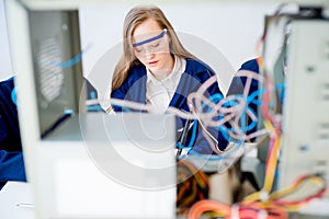 Female technician repairing a computer