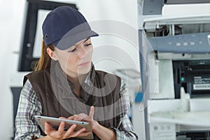 Female technician using tablet computer