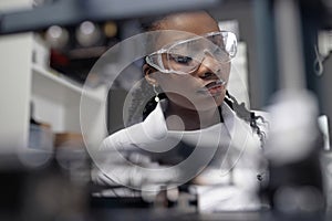 Female Technician Wearing Safety Glasses in Laboratory