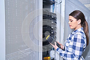 Female technician working on server maintenance