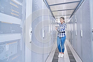 Female technician working on server maintenance