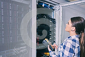 Female technician working on server maintenance