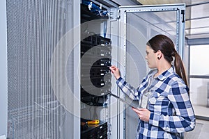 Female technician working on server maintenance