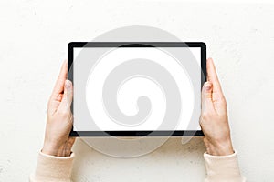 Female teen hands using tablet pc with white screen, mockup image of woman hand holding white tablet pc with blank white