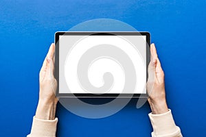 female teen hands using tablet pc with white screen, Mockup image of woman hand holding white tablet pc with blank white