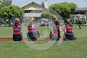 Female teen hockey players witing for the game