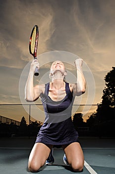 Female tennis player celebrating