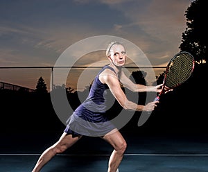 Female tennis player ready for ball photo