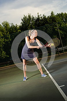 Female tennis player serving