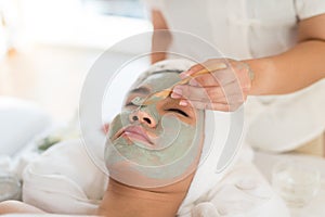 A female therapist doing Facial Spa/Treatment Add moisture to th