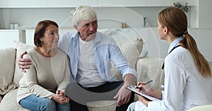 Female therapist listen to older couple share health complaints