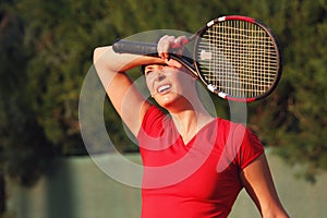 Female tired woman tennis player, racket. Wipes sweat