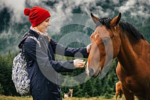 Female touching for houre face in mountain nature