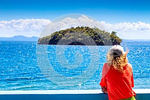 Female tourist enjoying beautiful panoramic ocean view with an island in Samana Bay. Vacation background. Idyllic landscape in