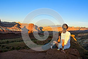 Female tourist enjoying the sunset in capitol reef national park, utah, united states of america