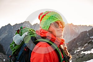 Female tourist hiking at High Tatras at gold sunset, Slovakia