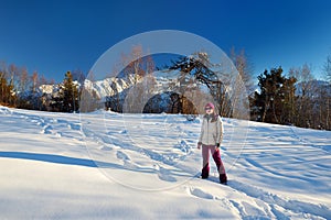 Female tourist hiking at Zuruldi mount in Hatsvali, Upper Svaneti region of Georgia.