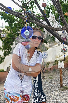 Female tourist near the amulets on the tree