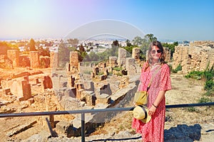 A female tourist near the ruins of Hannibal`s house in Carthage, Tunisia, Africa