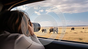 Female Tourist Photographing Elephants on African Safari