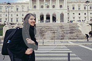 Female tourist standing in front of the Parliament of Portugal, Assembly of the Republic photo