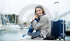 Female tourist standing at pier