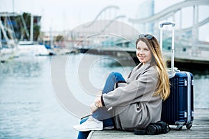 Female tourist standing at pier