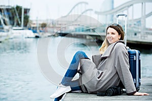 Female tourist standing at pier