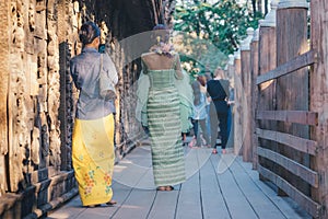 Female tourist take a photo at Shwe Nan Daw Kyaung Golden Palace Monastery