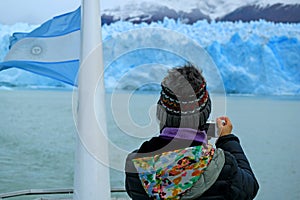 Female Tourist taking Photos of the Glacier Wall of Perito Moreno Glacier from the Cruise Ship on Lake Argentino, Argentina