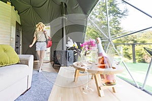 female tourist in transparent hotel dome.