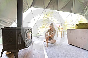 female tourist in transparent hotel dome.