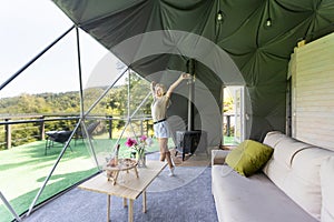 female tourist in transparent hotel dome.