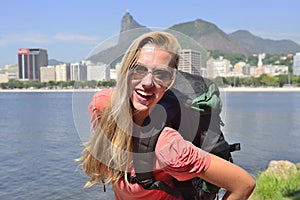 Female tourist traveling at Rio de Janeiro with Christ Redeemer.