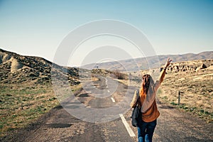 Female tourist walking down the road in Cappadocia