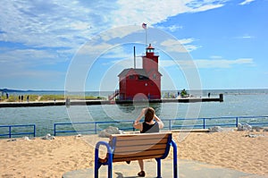 Female Tourists Photographs Holland Harbor Lighthouse