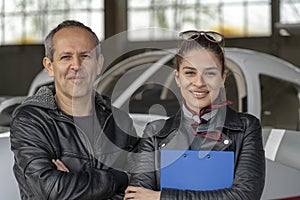 Two Smiling Pilots at the Airport photo