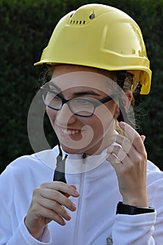 Female trainee with yellow security helmet