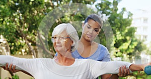 Female trainer assisting senior woman in exercising with dumbbells 4k