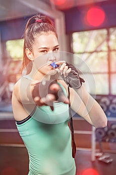 Female trainer blowing whistle