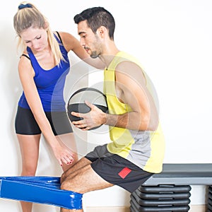 Female trainer explaining squat training