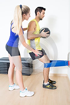 Female trainer explaining squat training